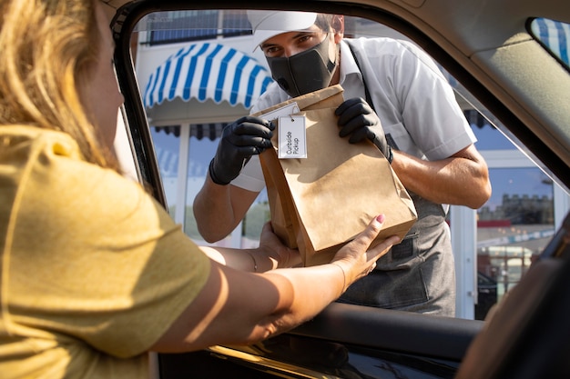 Man giving an order for a curbside pickup