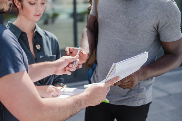 Man giving paper to sign