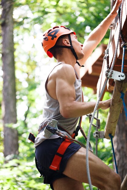 Man goes up on the rope ladder