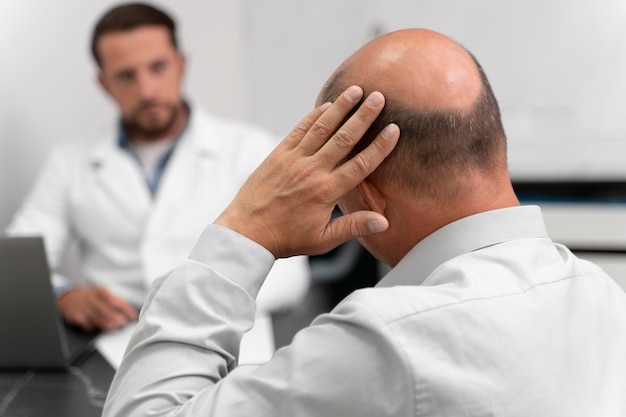 Man going through a follicular unit extraction process