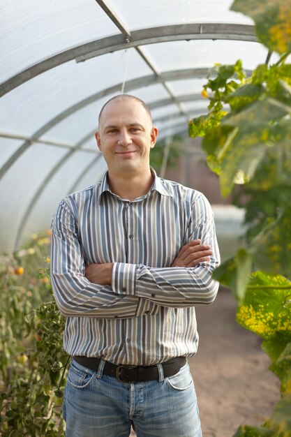 man in greenhouse