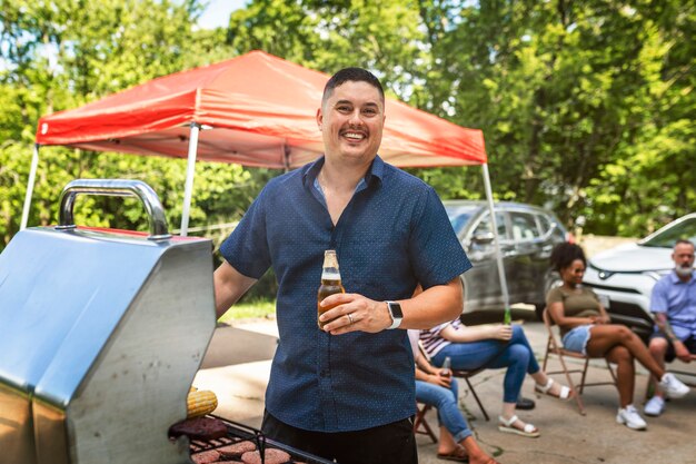 Man grilling on the bbq at a tailgate party