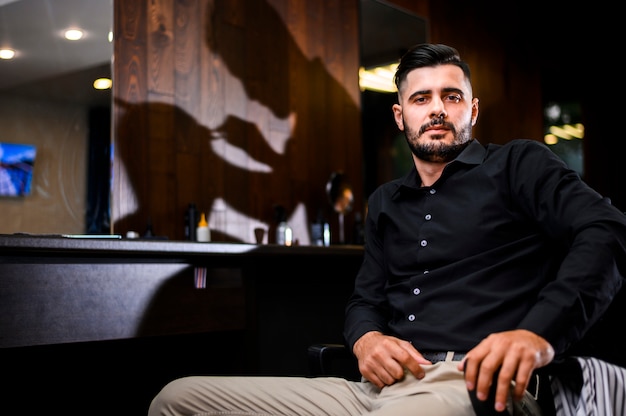 Man at hair salon facing the camera