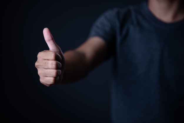 man hand measuring invisible items. Isolated on gray