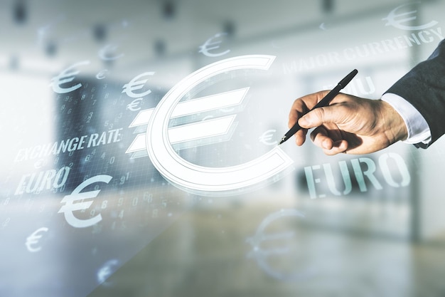 Free photo man hand with pen working with virtual euro symbols illustration on blurred office background forex and currency concept multiexposure