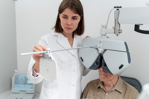 Free photo man having an eye sight check at an ophthalmology clinic