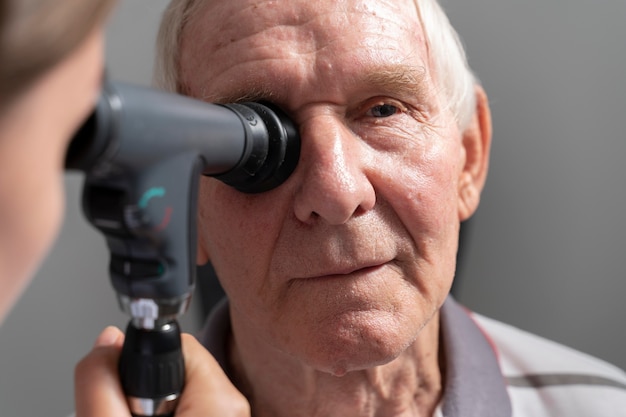 Free photo man having an eye sight check