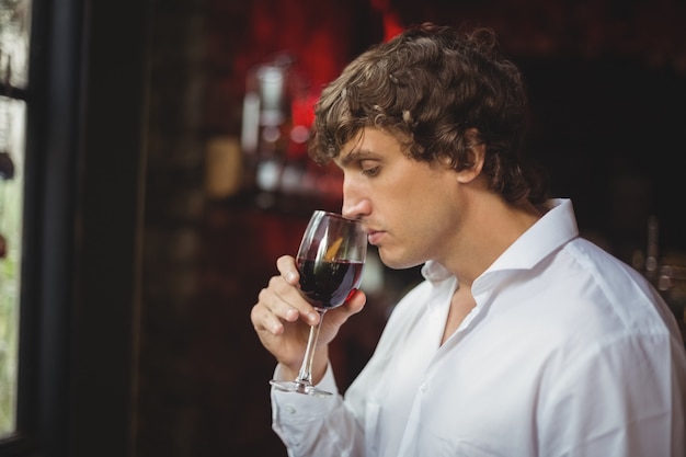 Man having a glass of red wine