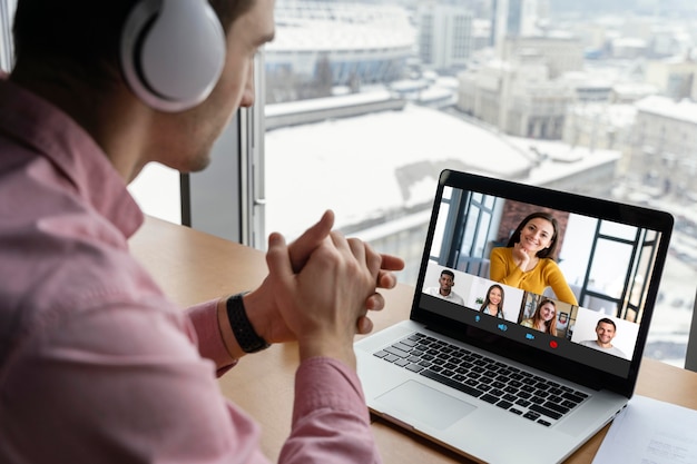 Man having an online video call with coworkers