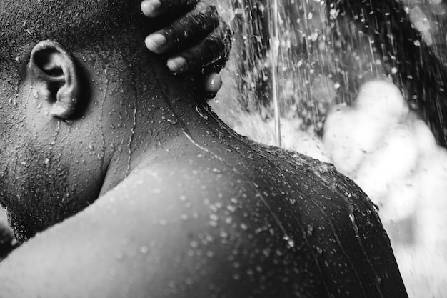 Man having an outdoor shower