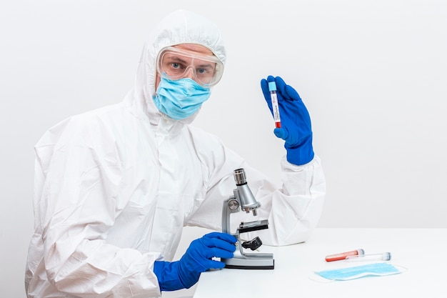 Man in hazmat suit with blood sample