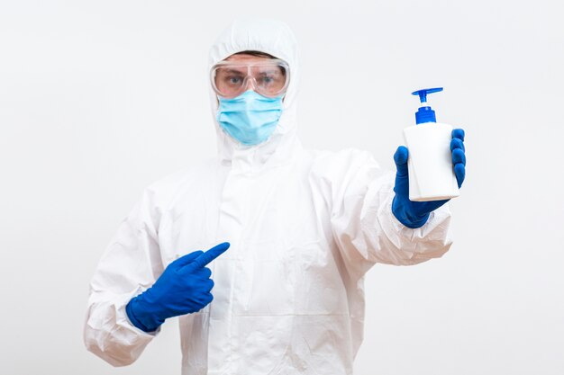 Man in hazmat suit with soap bottle