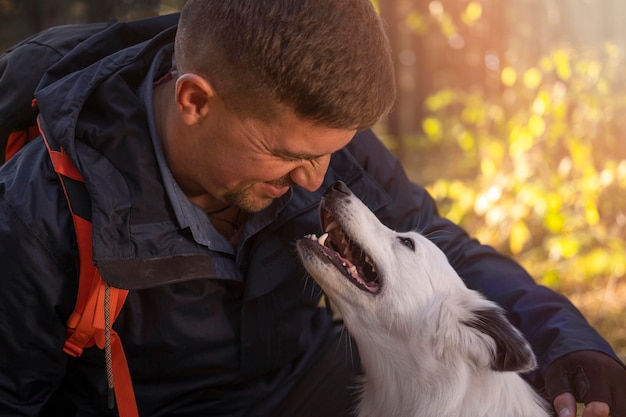 Free photo man and his dog outdoors