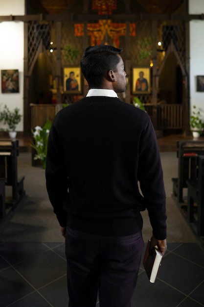 Man holding bible book in the church