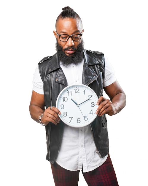 Man holding a big clock