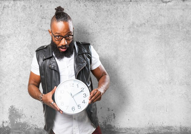 Man holding a big clock