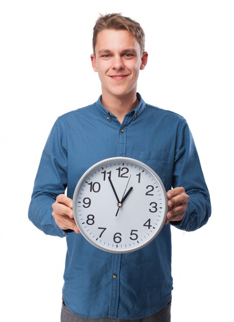 Man holding a big clock