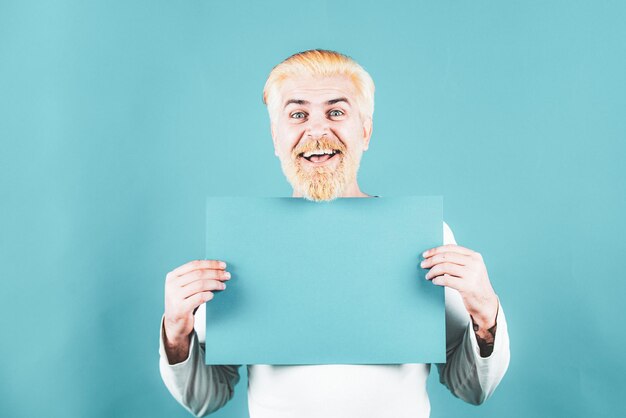 Man holding blank card blank empty paper billboard with copy space for text