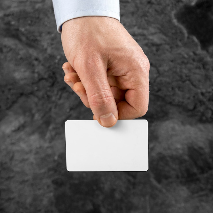 Free Photo man holding a blank card