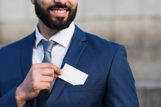 Man holding business card