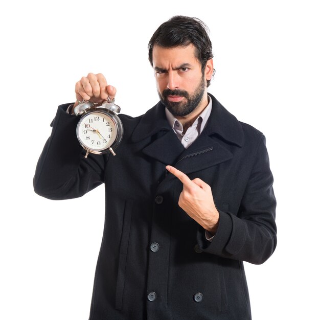 Man holding a clock