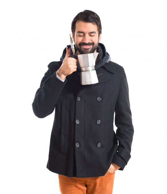 Free photo man holding coffee pot