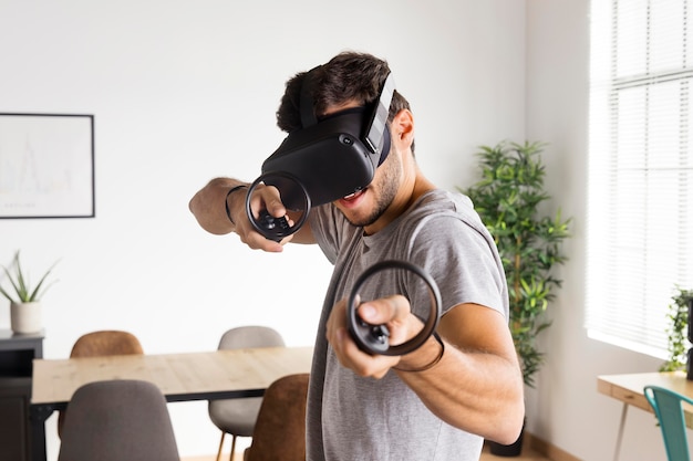 Man holding controllers medium shot