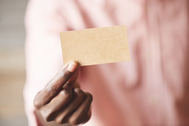 Free photo man holding credit card closeup