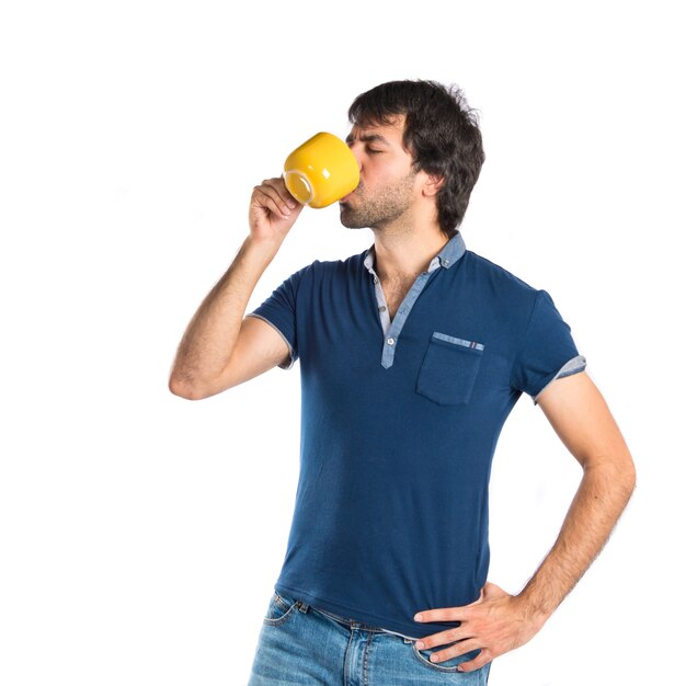 Man holding a cup of coffee over white background