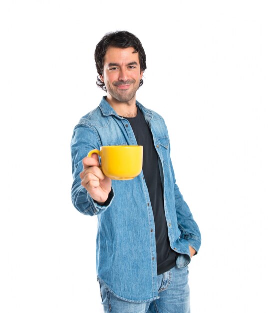 Man holding a cup of coffee over white background