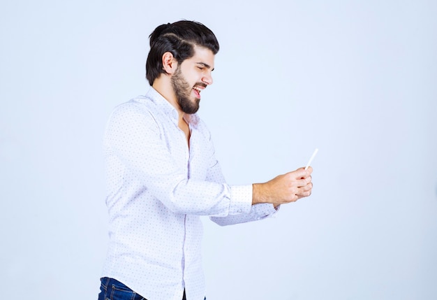 Man holding and demonstrating his business card to the new partners