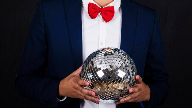 Man holding disco ball 