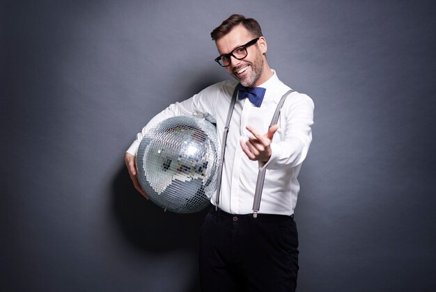 Man holding a disco ball
