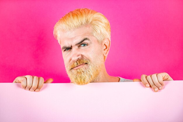 Man holding empty pink blank board isolated on the color background