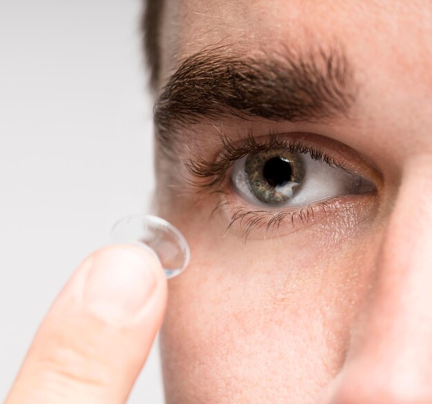 Man holding an eye contact close-up