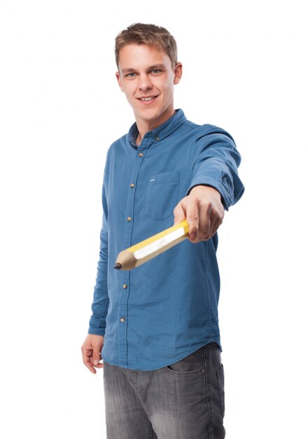 Man holding a giant pencil