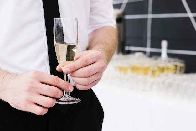 Man holding glass of champagne