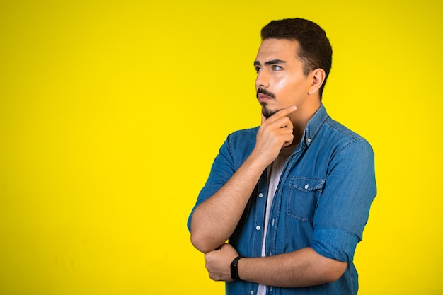 Man holding his chest and thinking deep about new project