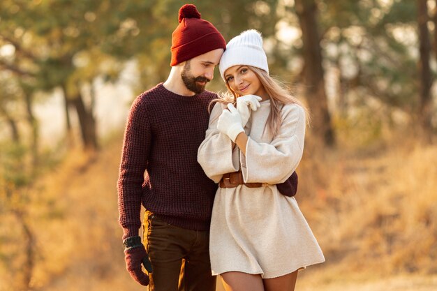 Man holding his friend while looking at her