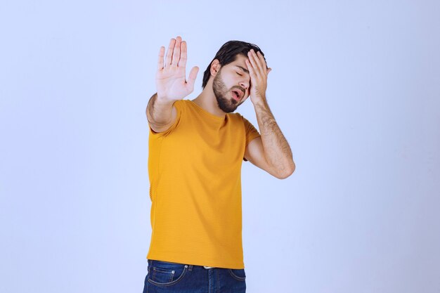 Man holding his head as he has headache