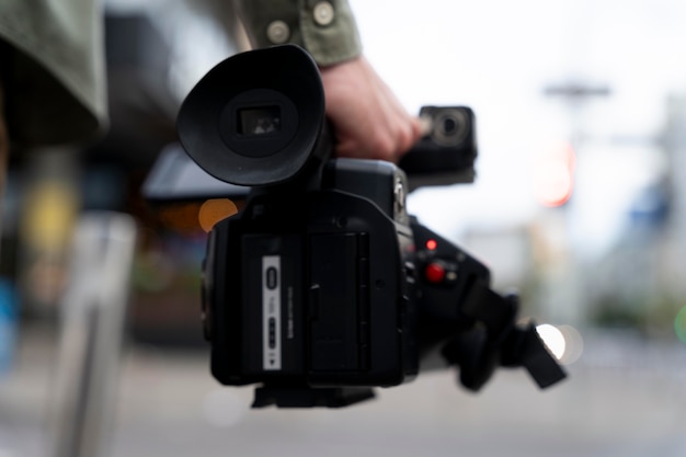 Man holding his news camera