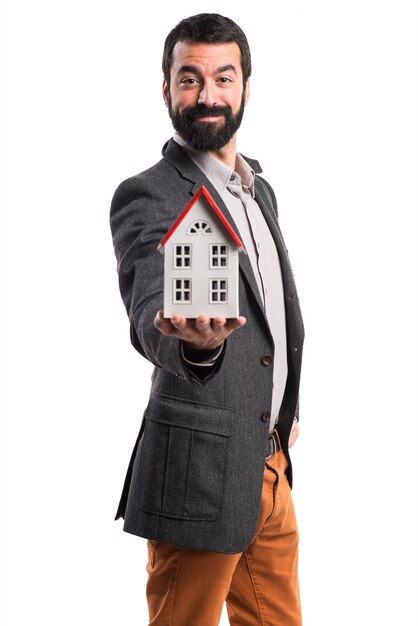 Man holding a little house