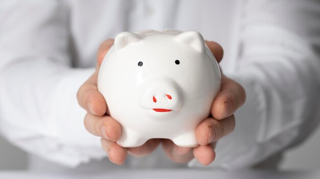 Man holding a piggy bank