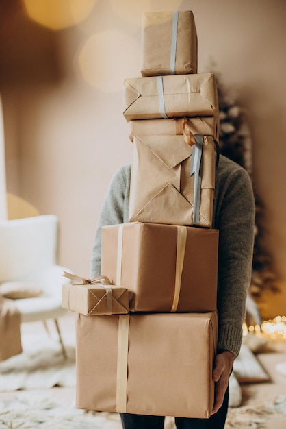 Man holding plenty of christmas presents