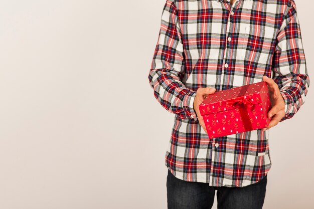 Man holding red present