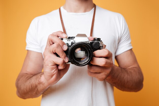 Man holding retro camera