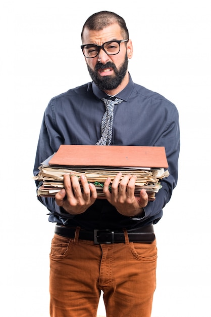 Free photo man holding several college notes