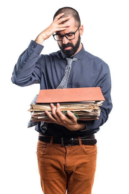 Free photo man holding several college notes