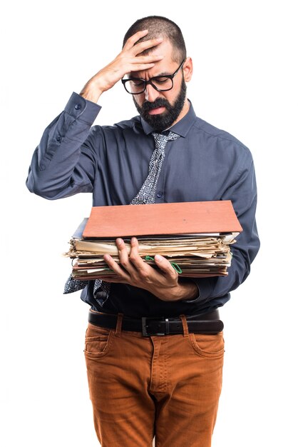 Man holding several college notes