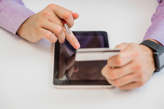 Man holding smart phone and credit card. Shopping Online.